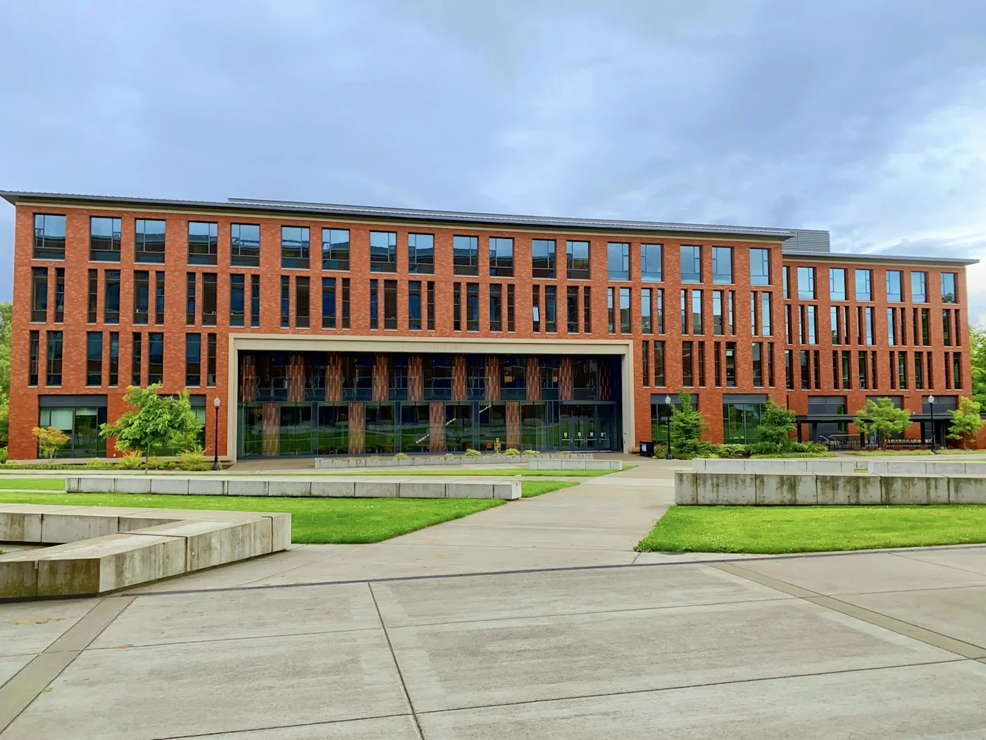 A modern university building and open campus